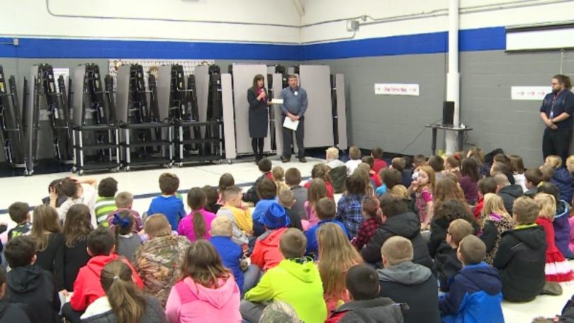 Dollar General presents surprise check to Clendenin Elementary