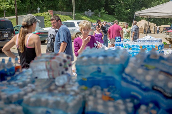 Residents collected donated materials on Sunday in Clendenin, WV by Kyle Grillot via NY Times 6-26-2016