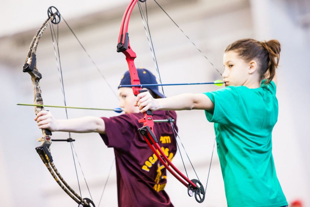 Alexandria Christian, 11, of Elkview Middle and Adam Workman, 11, of Marlington Middle draw back their arrows