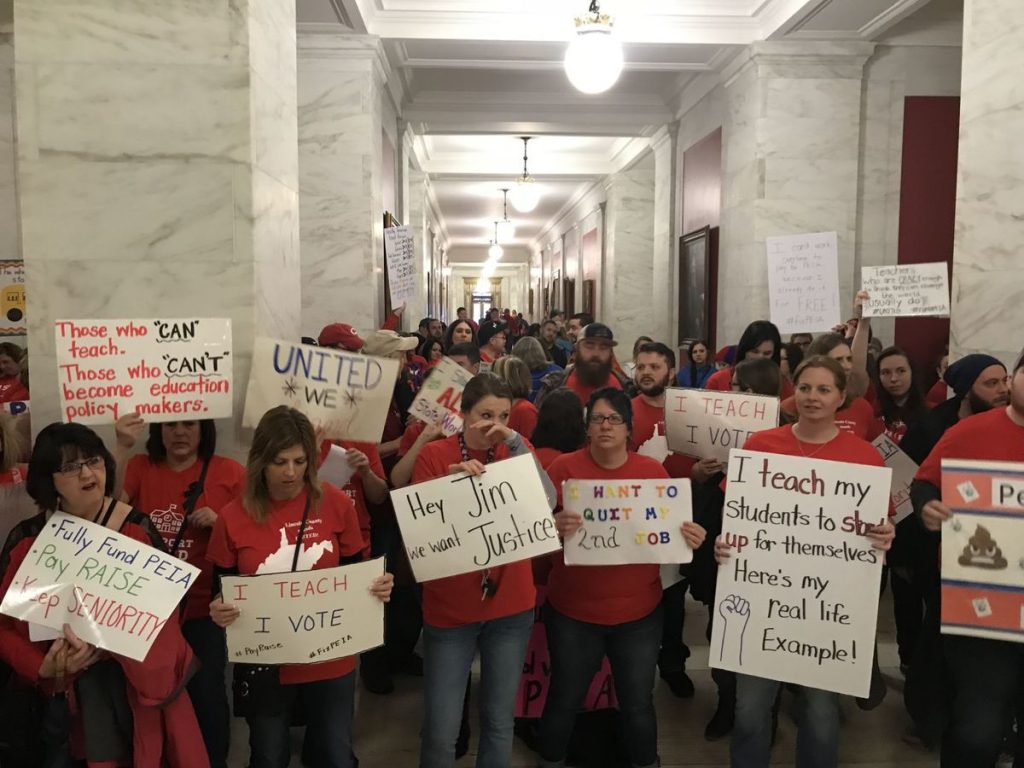 Hundreds of teachers rally in the lower rotunda Friday morning before both chambers of the Legislature started their floor sessions by Jake Jarvis