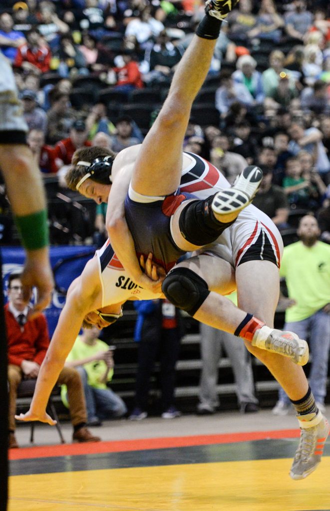 Nitro’s Paul Frampton throws down Adam Daniels of Independence during the AA-A 182-pound championship match, won by Frampton. Chris Dorst | Gazette-Mail