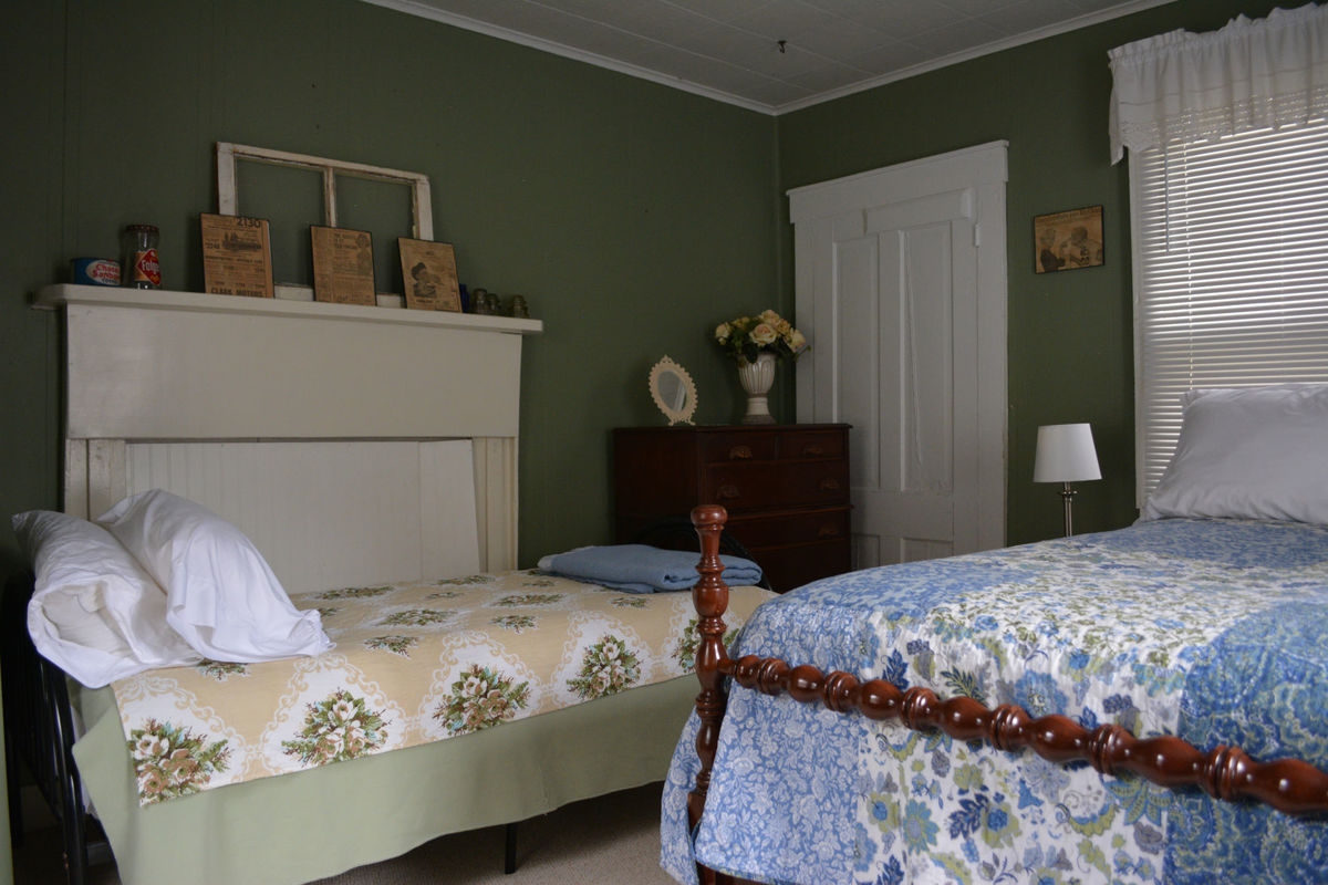 The main farmhouse at Country Road House and Berries has two nicely furnished bedrooms and one bathroom
