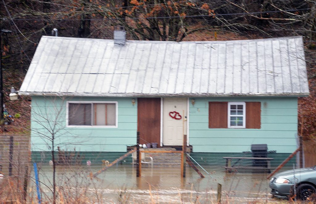 The yard of a home on Orchard Road, in the Fayette County community of Whipple, was flooded after heavy weekend rains