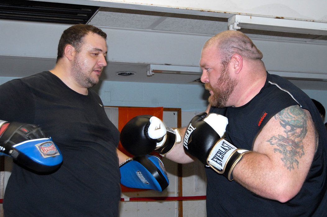 Chris Bowen of Cross Lanes, right, hones his boxing skills against Brad Mullins at the Elk River Boxing Club's new Elkview location. Ben Calwell | Metro