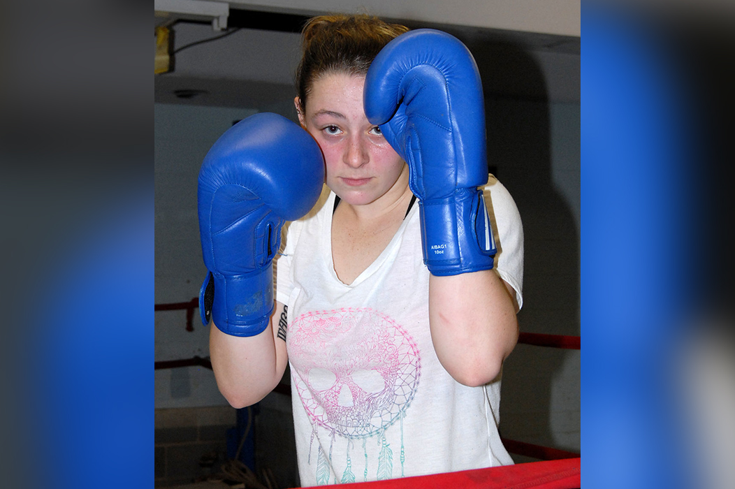 Emilee Morgan of Walton strikes a boxer's pose in the new Elk River Boxing Club in Elkview. Ben Calwell | Metro