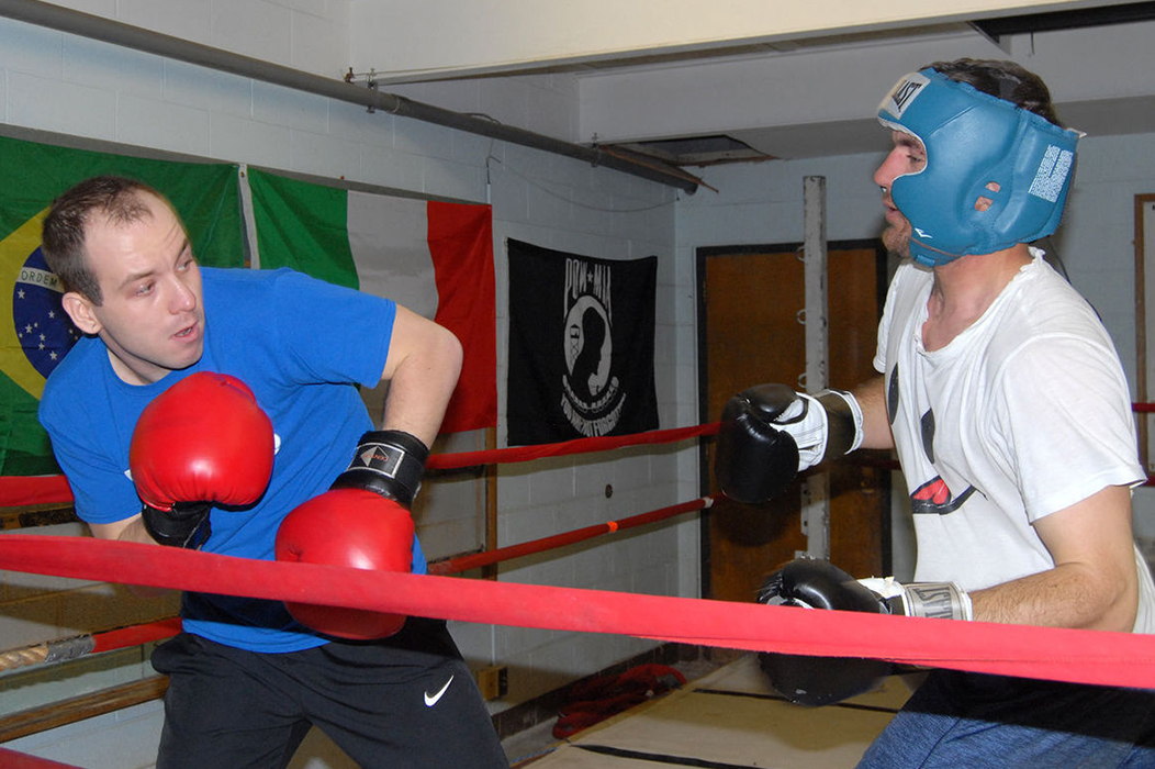 Zach Gillenwater, left, a member of Glenville State University's boxing team, spars with Dave Gibson of Walton at the Elk River Boxing Club. The Glenville State team sometimes trains at the Elk River facility. Ben Calwell | Metro
