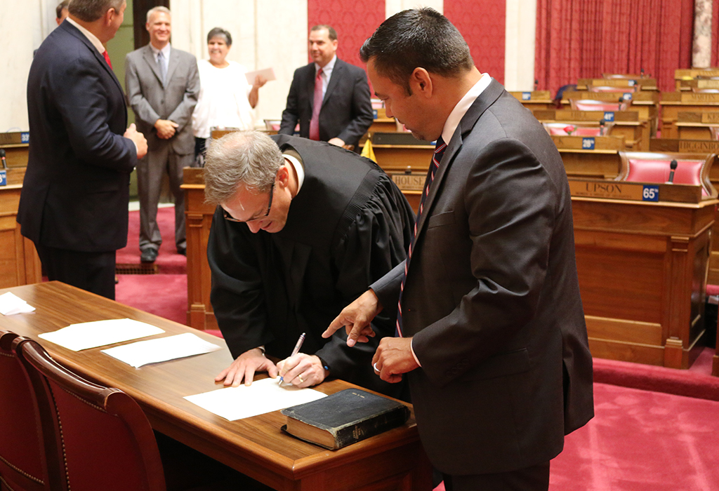 Judge Dan Greear signing Dean Jeffries oath of office agreement. Photo Credit - Mark Burdette